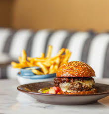 Compline Restaurant and Wine Shop signature dishes Duck Fat Fries, The Compline Burger, Wild Mushroom Arancini.